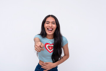 An asian trans woman mocking and taunting someone, pointing with her finger. Making fun of a person while laughing. Isolated on a white backdrop.