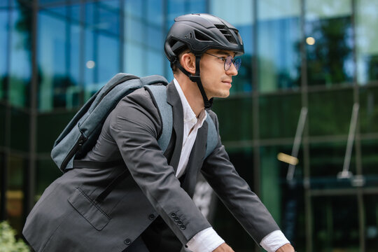 Young manager commuting to the office by bike