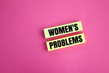 colored paper with the word women's problems. the concept of female habit problems