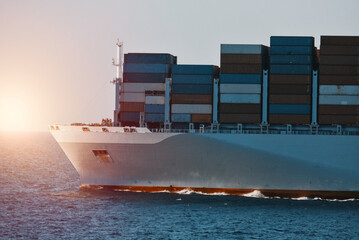 Cargo ship underway. Shipping of containers by sea. International supply chain goods delivery.