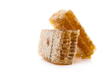 Bee products with honey and sweet honeycomb isolated on white background