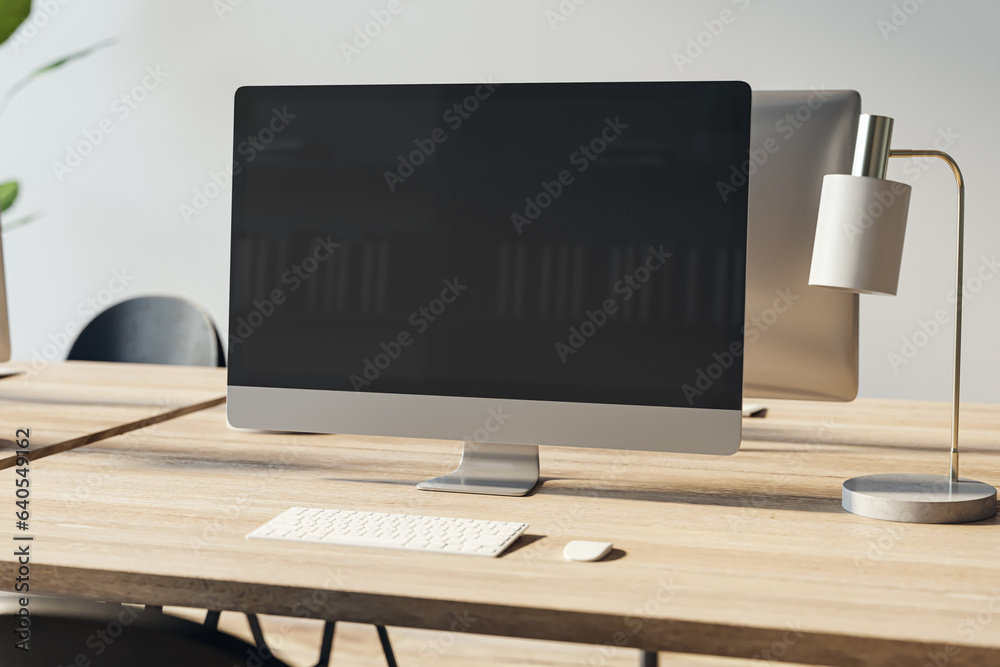 Poster Close up of empty computer screen on wooden office desktop with lamp and supplies on concrete wall background. Designer workplace concept. Mock up, 3D Rendering.