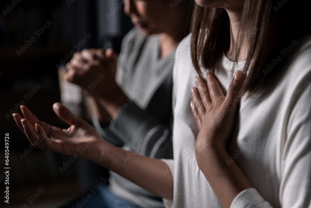 Wall mural Group of different women praying together, Christians and Bible study concept.