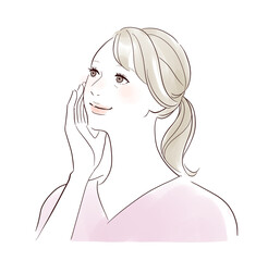 笑顔で頬を触るミドル女性