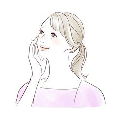 笑顔で頬を触るミドル女性