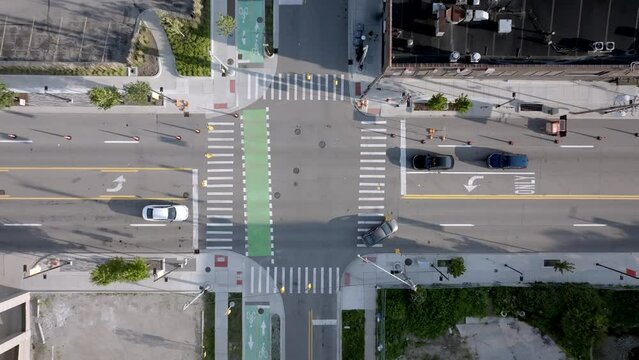 Downtown Ann Arbor, Michigan intersection with drone video moving up.