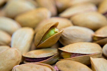 Pistachios on a brown background