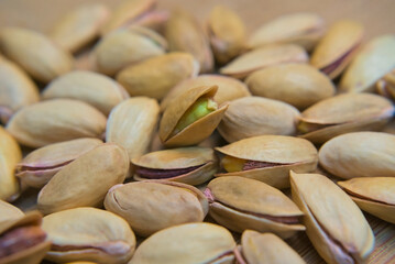 Pistachios on a brown background