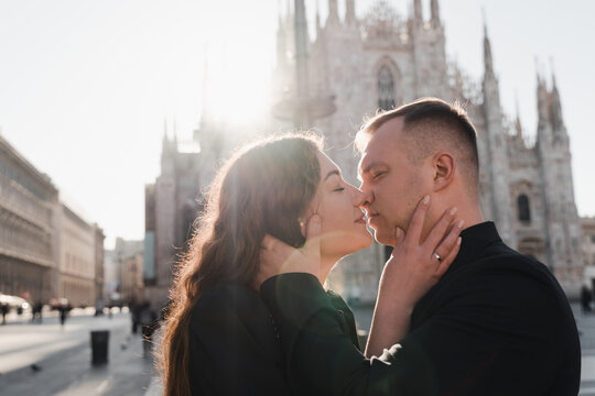 Close-up portrait of kissing lovers against the backdrop of the Duomo