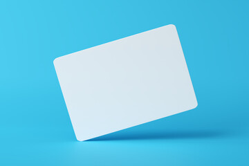 Mockup of a blank white business card hovering on blue background.