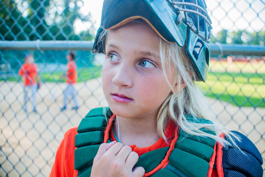 A 10 year old girl catcher on the baseball team
