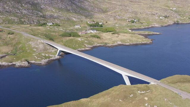 Aerial shot of the bridge connecting the Isle of Scalpay to the Isle of Harris on the Outer Hebrides of Scotland. The town of Tarbert and the surrounding bay is visible.
