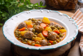 Turkish Food Green Pea Stew with Meatballs - Kofte or Kofta Bezelye. (Turkish name; kofteli bezelye)