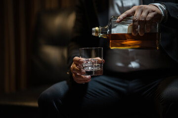 Whisky is poured into glass Beautiful bokeh