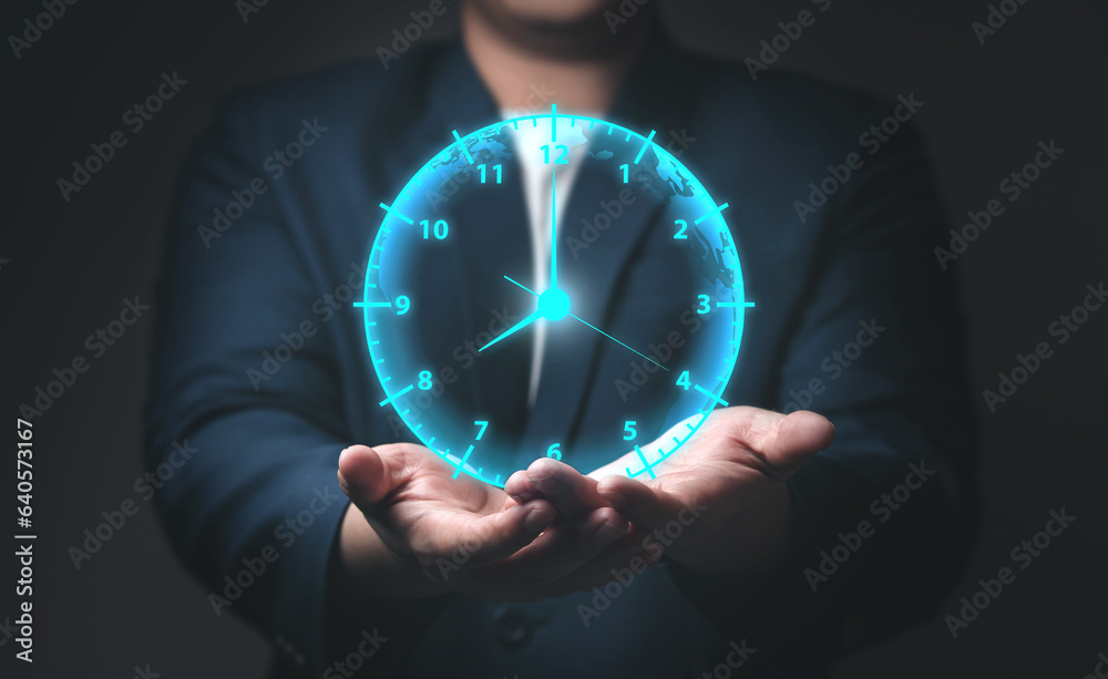 Aufkleber businessman showing a virtual clock in his hand. concept of saving time, overtime (ot), work hours o