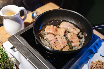 Fish roasting in a pan at a wedding buffet