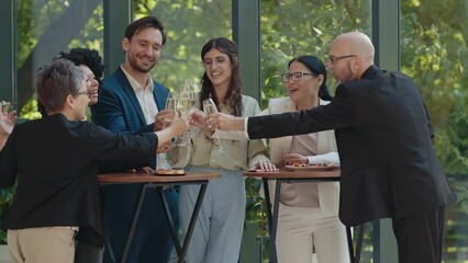 Cinematic footage of a business corporate party. Group of businessmen and businesswomen celebrating the annual company achievements 