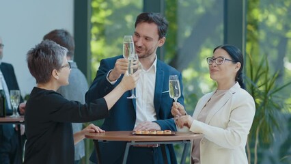 Cinematic footage of a business corporate party. Group of businessmen and businesswomen celebrating the annual company achievements 
