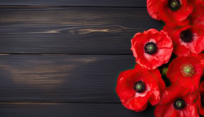 Red poppies on wooden background. Top view with copy space