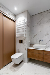 The interior of a modern bathroom in the apartment immediately after renovation