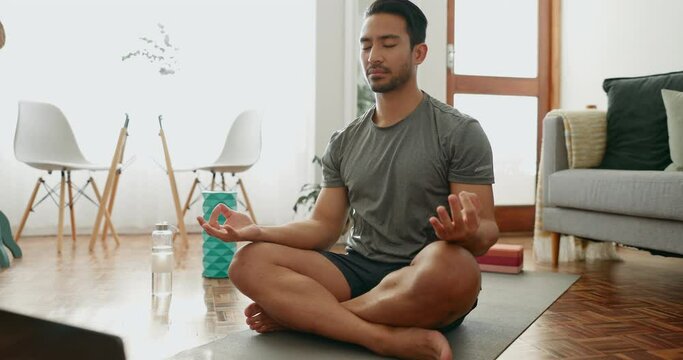 Man, meditation and yoga with mindfulness and laptop, prayer and online class with fitness in lounge. Wellness, health and peace, namaste and virtual exercise at home, spiritual and lotus pose