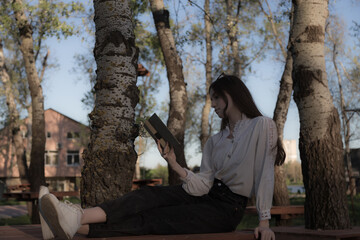 Portrait of a beautiful girl with a book.