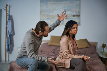 angry man arguing with african american woman, pregnancy test, scream and gesture, abortion concept