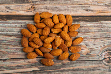 Almonds seed on wooden background