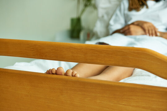 Cropped View Of Barefoot African American Woman, Toes, Bare Feel, Hospital Private Ward, Lying Down