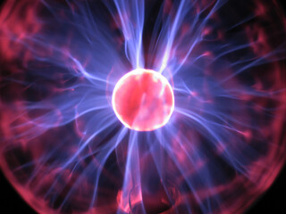 Red core of plasma ball with rays close up	
