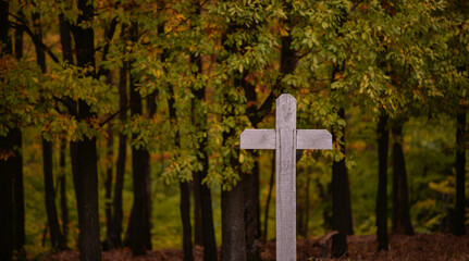 Wooden orthodox crosses in the autumn forest