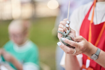 A master ceramist holds a clay product in his hands. Making a ceramic animal from clay. The process...