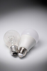 Old incandescent light bulb and new energy-saving light bulb