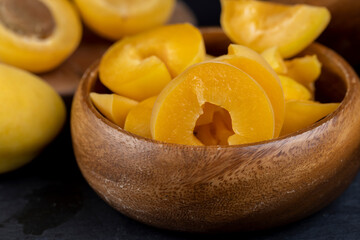 ripe yellow apricots on the table close-up