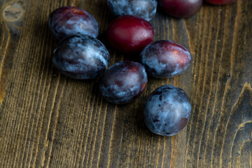 Ripe plums on the table in the kitchen