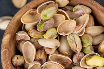a large number of salty and crispy pistachios close-up
