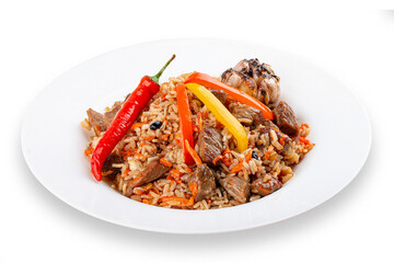 Uzbek-style pilaf on a decorative plate. Isolated
