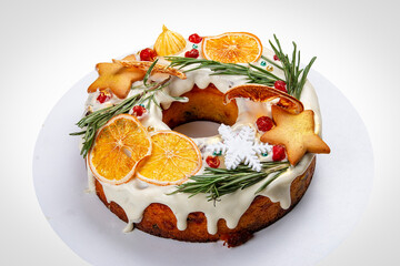 Holiday cake with oranges and candied fruit. New Year's menu. Isolated on a white background.
