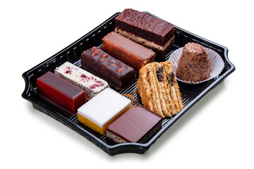 A set of gourmet cakes and desserts packaged for takeaway. Takeaway food. Isolated on a white background.