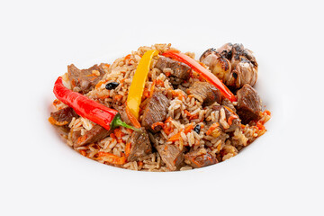 Uzbek-style pilaf on a decorative plate. Isolated