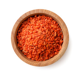 Dried carrots in a wooden plate close-up on a white. Top view
