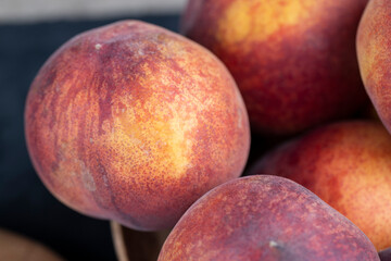 ripe delicious and fresh peaches of a red hue