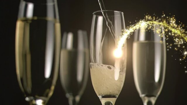 Animation of firework moving around champagne pouring in flutes on black background