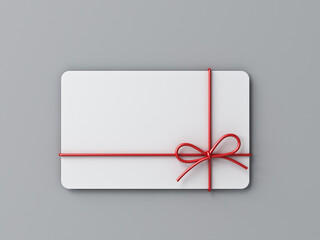 Blank minimal white gift card with red rope ribbon bow isolated on grey background with shadow...