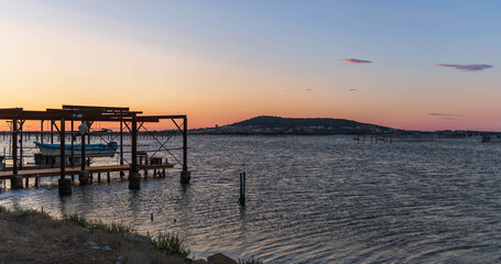 Obraz premium Oyster farm on the Etang de Thau at sunrise, in Loupian, in Occitanie, France