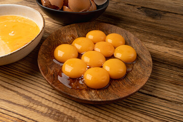 Egg Yolks in Bowl, Fresh Chicken Egg Yolk Separated from Whites for Cooking Recipe, Organic Yolks Top View