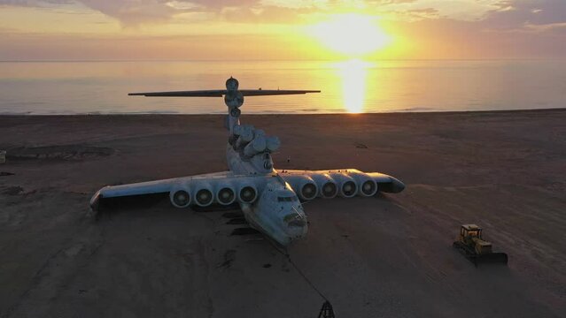 Scenery aerial view of famous water airplane Lun on the coast of Kaspian sea during sunrise. Famous ekranoplan Lun