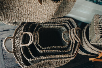 several wicker baskets in order from largest to smallest size 