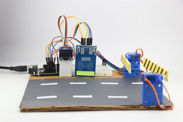 Prototype of automatic toll collection system using RFID sensor and servo with OLED. Working arduino projects made for mini engineering projects