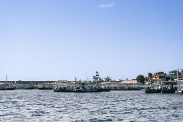 Fototapeta premium Egypt Summer Travel Tranquil Waterside Haven: Boats in a Nile River Village